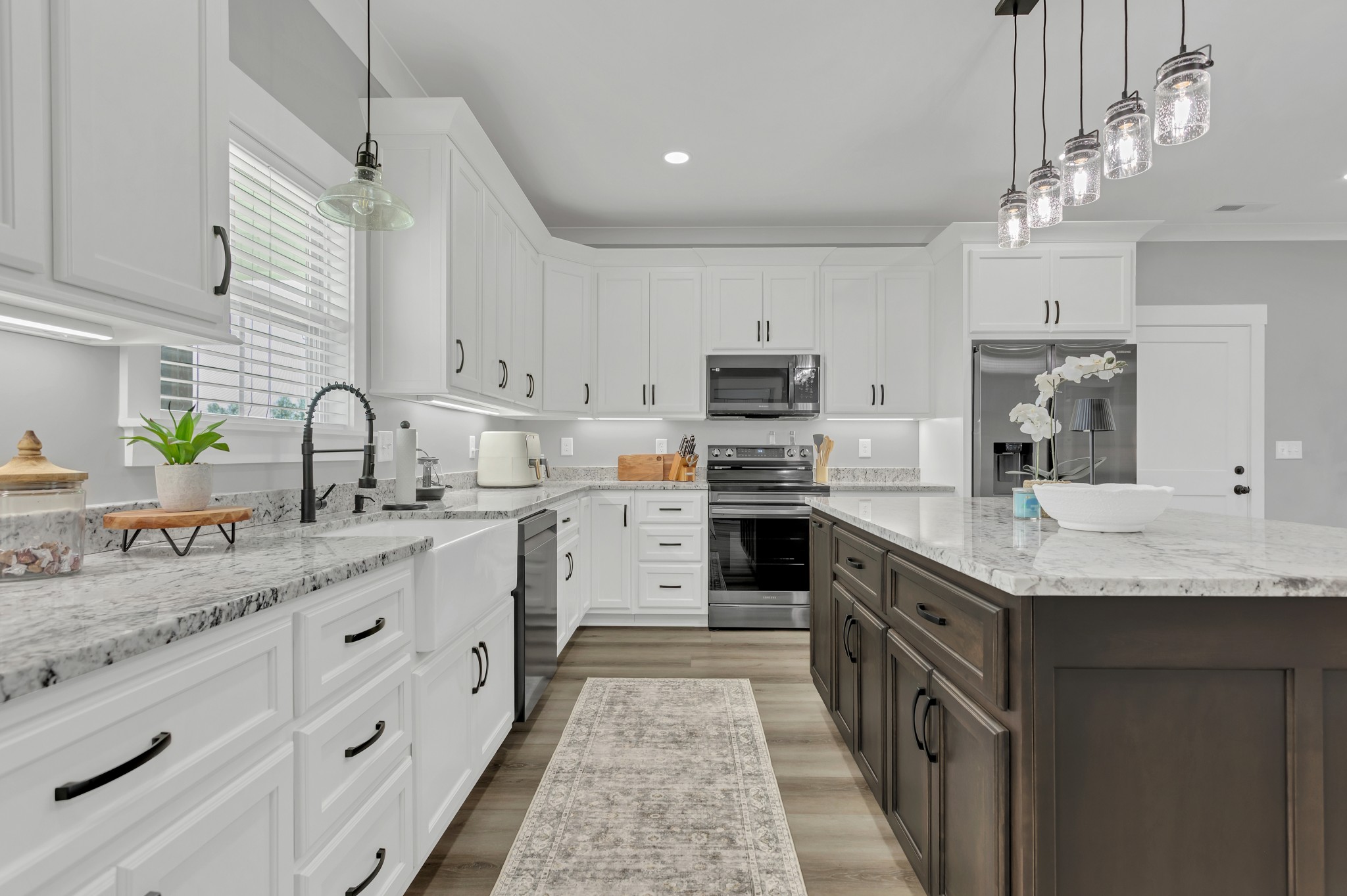 200 Beartown Road Loretto, TN 38469 - Photo 10 of 24 a kitchen with stainless steel appliances granite countertop a sink stove and refrigerator
