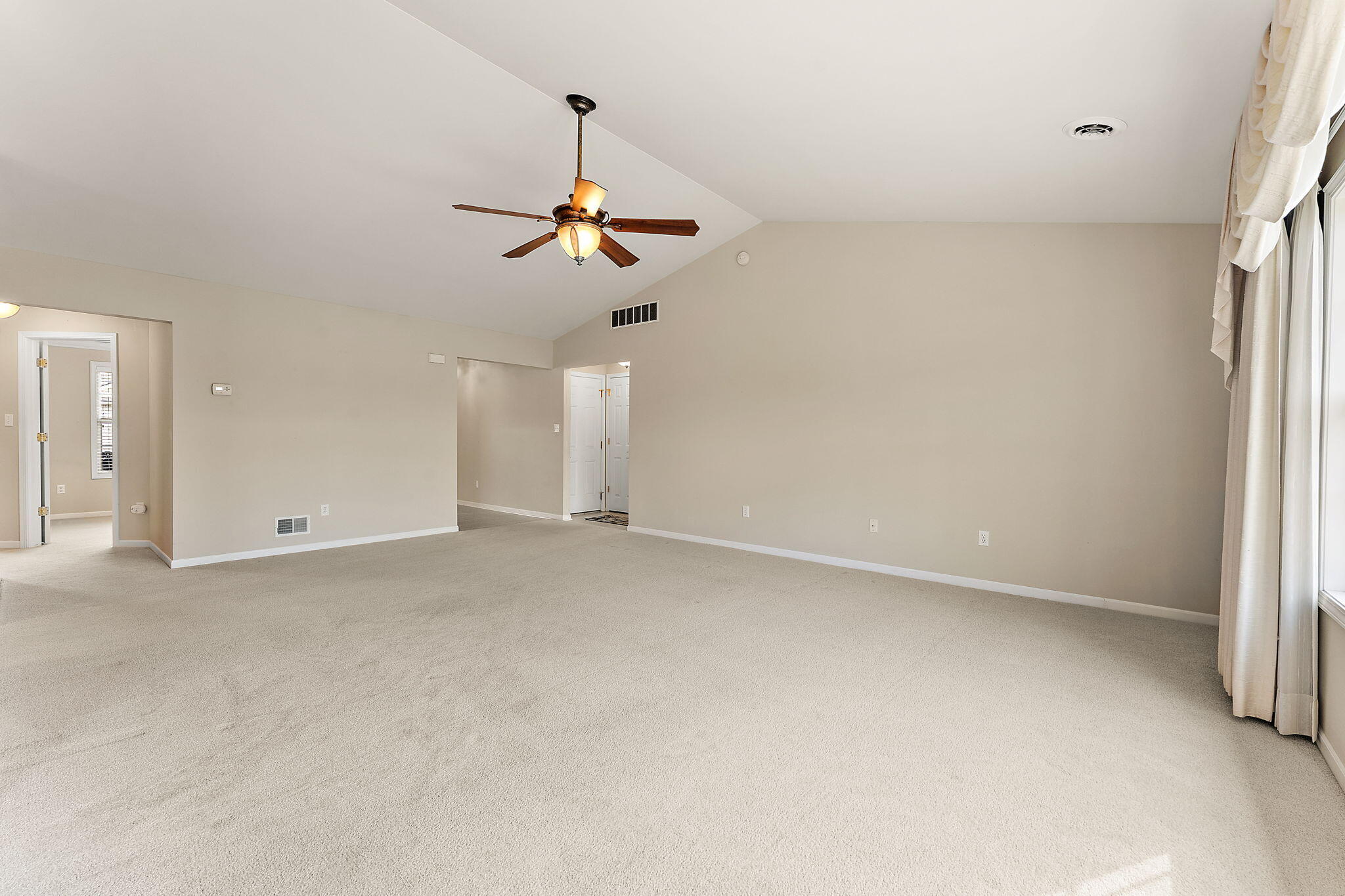 901 Veterans Lane Crown Point, IN 46307 - Photo 9 of 40 a view of room with a ceiling fan and window