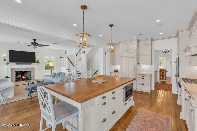 a bathroom with a toilet a sink and a large mirror