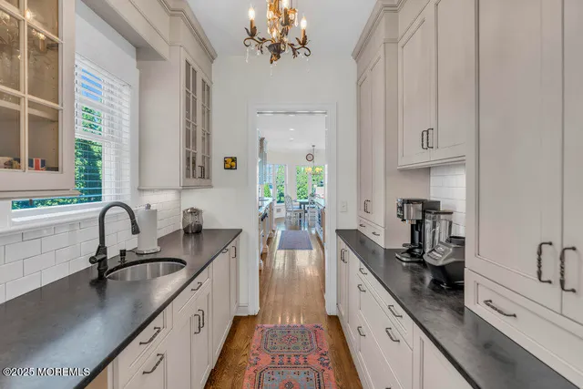 a bathroom with a sink vanity and a mirror