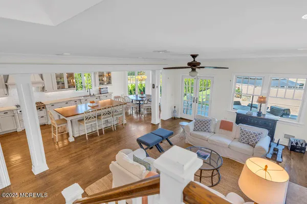 a spacious bathroom with a tub sink and mirror