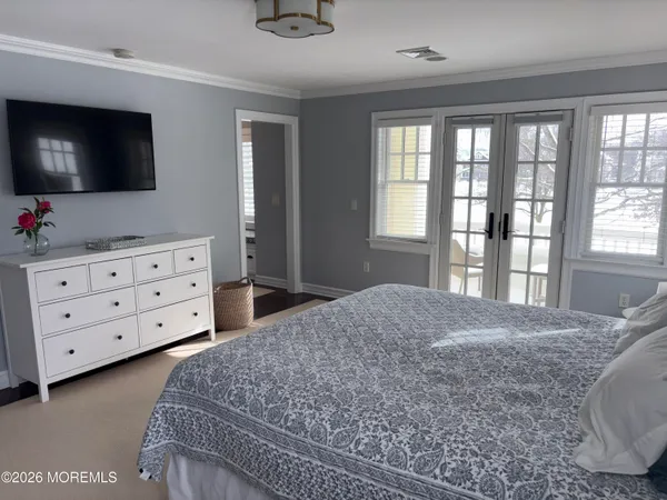 a bedroom with a bed and a couch