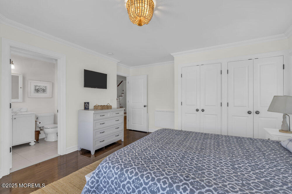 420 Tuttle Avenue Spring Lake, NJ 07762 - Photo 27 of 43 a bedroom with a baby bed and a window