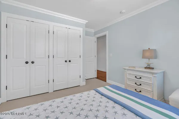 a bathroom with a toilet a sink and a large mirror