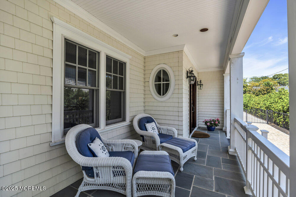 420 Tuttle Avenue Spring Lake, NJ 07762 - Photo 3 of 43 a view of a porch with furniture and a window