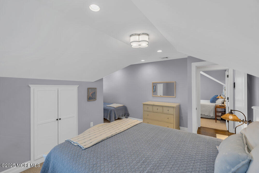 420 Tuttle Avenue Spring Lake, NJ 07762 - Photo 34 of 43 a bedroom with a bed and a couch