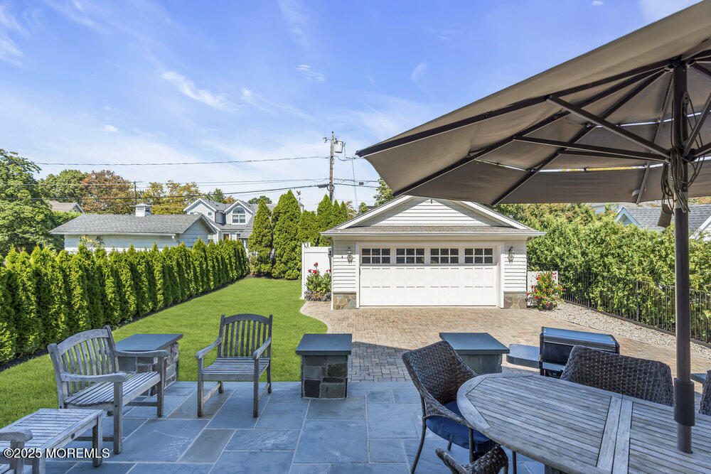 420 Tuttle Avenue Spring Lake, NJ 07762 - Photo 40 of 43 a view of a patio in a backyard