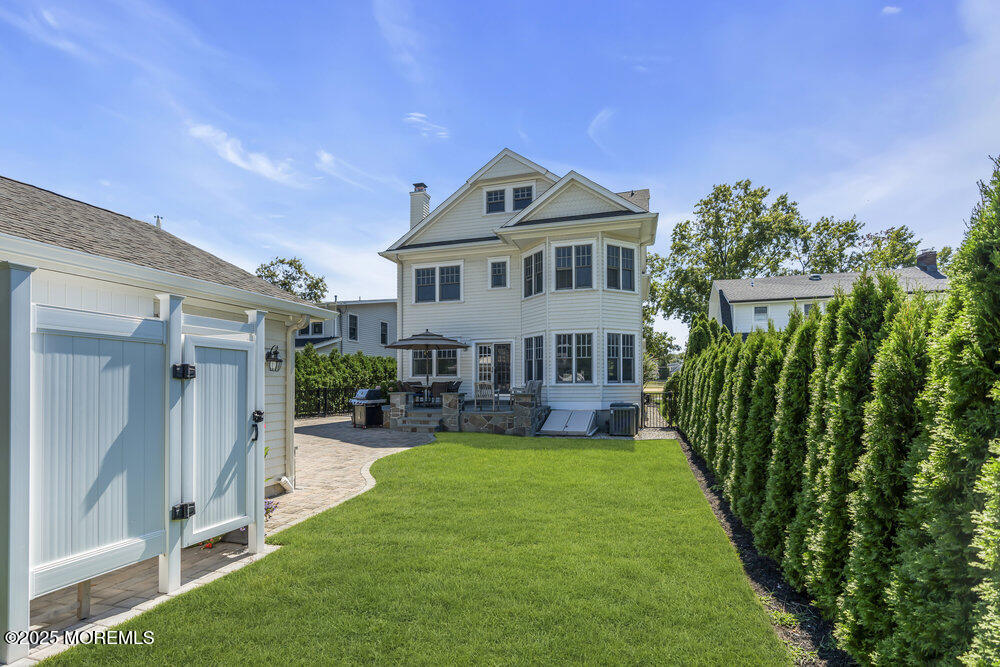 420 Tuttle Avenue Spring Lake, NJ 07762 - Photo 41 of 43 a view of a house with a yard porch and sitting area