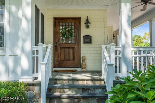 a view of staircase with white walls and windows
