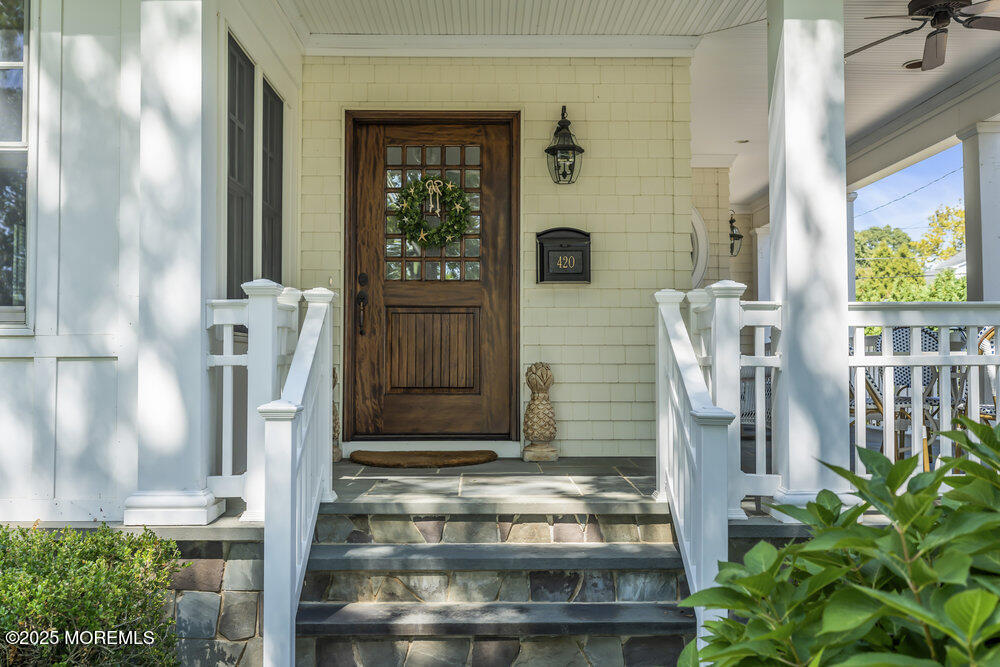 420 Tuttle Avenue Spring Lake, NJ 07762 - Photo 5 of 43 a front view of a house with a porch