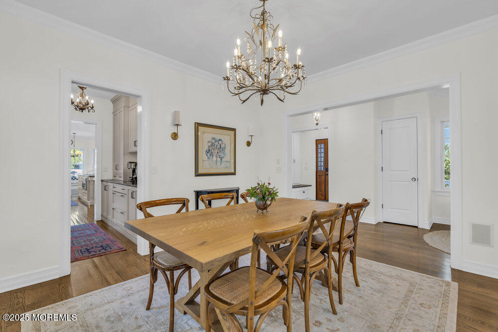 420 Tuttle Avenue Spring Lake, NJ 07762 - Photo 9 of 43 a view of a dining room with furniture and chandelier