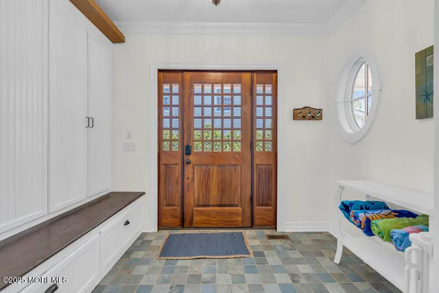a bedroom with a baby bed and a window