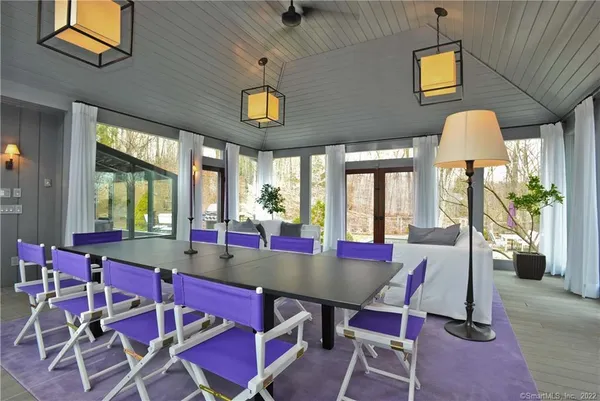 a view of a dining room with furniture window and outside view
