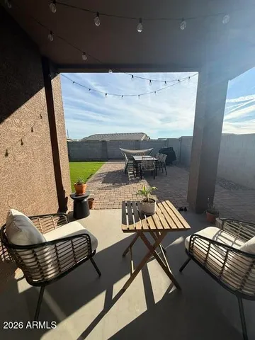 a terrace of a house with outdoor seating