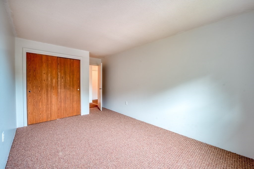 80 Stanton Street, Unit 32 Worcester, MA 01605 - Photo 11 of 21 an empty room with closet area