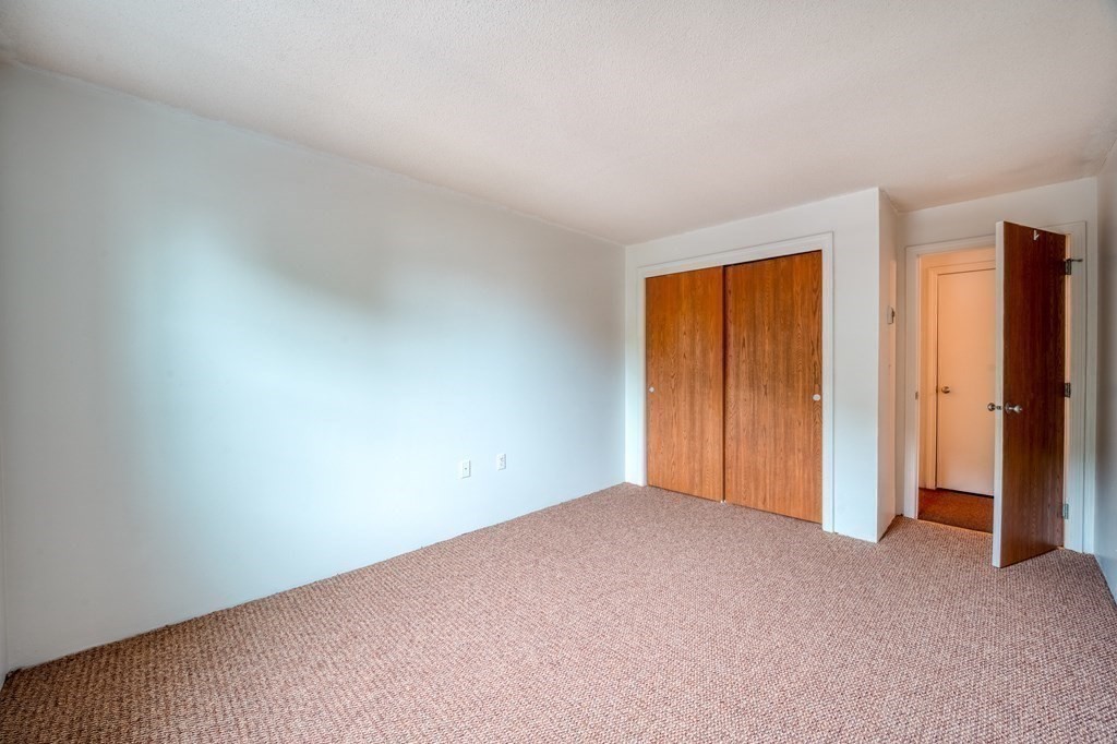 80 Stanton Street, Unit 32 Worcester, MA 01605 - Photo 12 of 21 a view of an empty room and a window