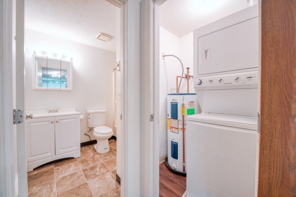 80 Stanton Street, Unit 32 Worcester, MA 01605 - Photo 14 of 21 a bathroom with sink toilet and shower