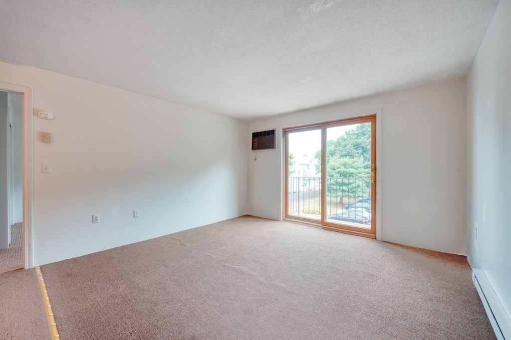 80 Stanton Street, Unit 32 Worcester, MA 01605 - Photo 4 of 21 a view of an empty room with a window