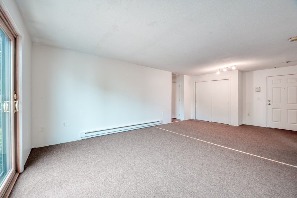 80 Stanton Street, Unit 32 Worcester, MA 01605 - Photo 5 of 21 an empty room with a natural light