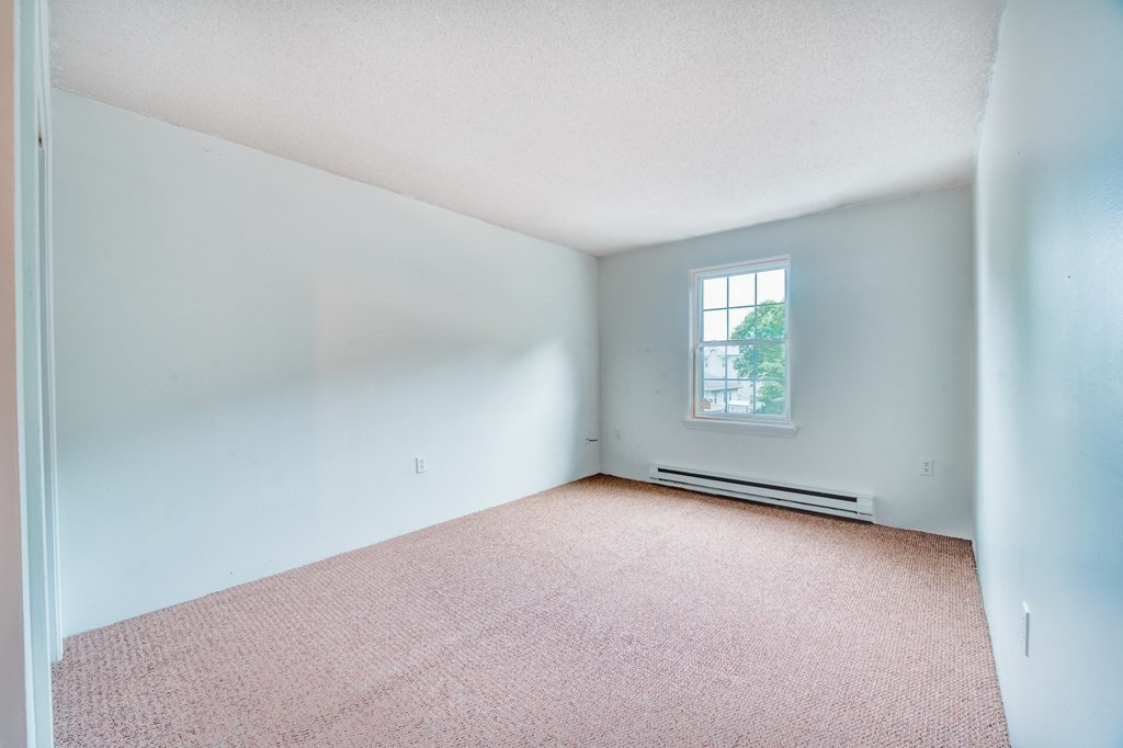 80 Stanton Street, Unit 32 Worcester, MA 01605 - Photo 7 of 21 an empty room with windows