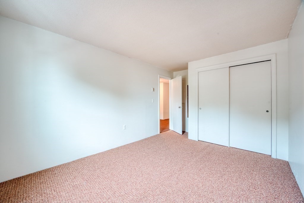 80 Stanton Street, Unit 32 Worcester, MA 01605 - Photo 9 of 21 a view of a big room with closet and chandelier fan