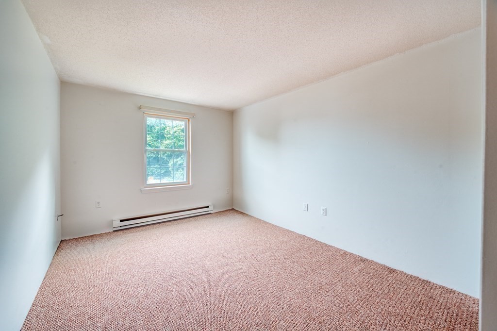 80 Stanton Street, Unit 32 Worcester, MA 01605 - Photo 10 of 21 an empty room with windows
