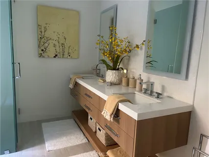 a bathroom with a sink a vanity and a mirror