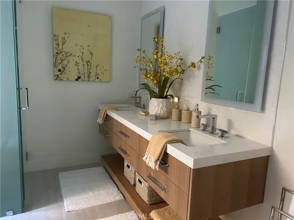 a bathroom with a sink a vanity and a mirror