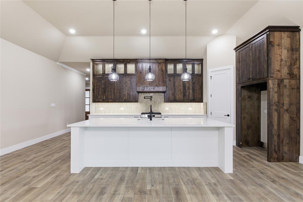 702 Anne Road Van Alstyne, TX 75495 - Photo 6 of 27 Kitchen featuring an expansive center island with a white countertop