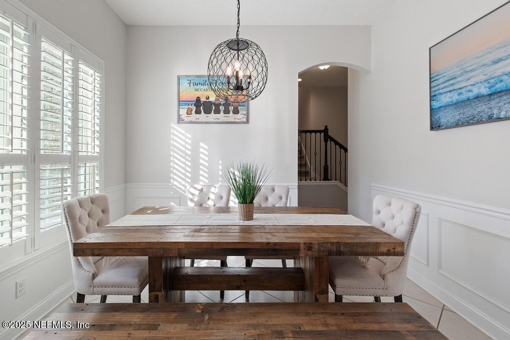 10944 Lothmore Road Jacksonville, FL 32221 - Photo 15 of 85 a view of a dining room with furniture window and wooden floor
