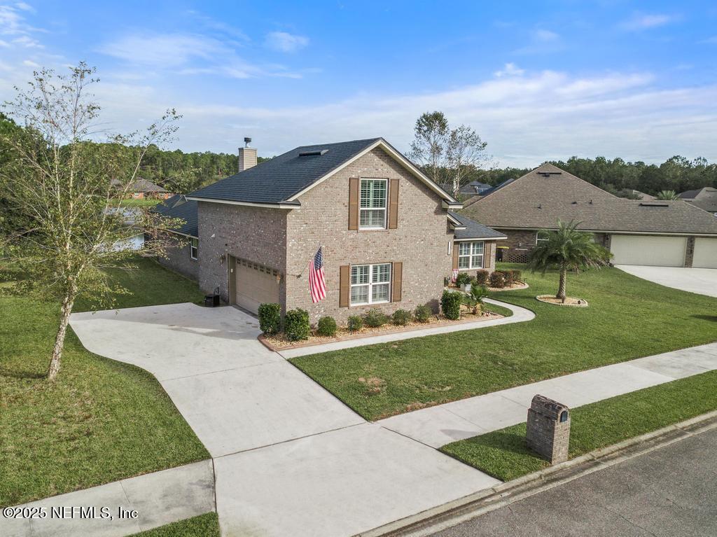 10944 Lothmore Road Jacksonville, FL 32221 - Photo 3 of 85 a view of a house with a yard