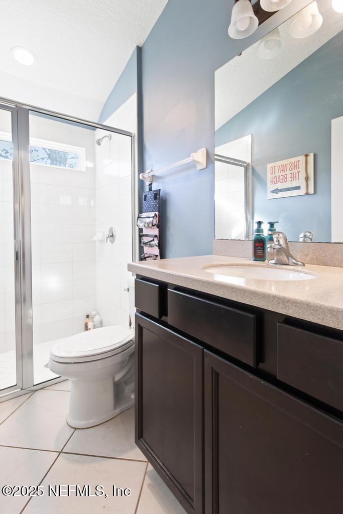 10944 Lothmore Road Jacksonville, FL 32221 - Photo 36 of 85 a bathroom with a sink a toilet and shower