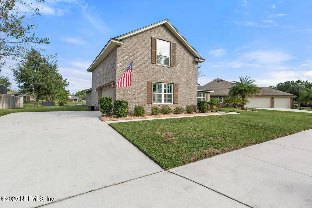 10944 Lothmore Road Jacksonville, FL 32221 - Photo 5 of 85 a front view of house with yard and green space