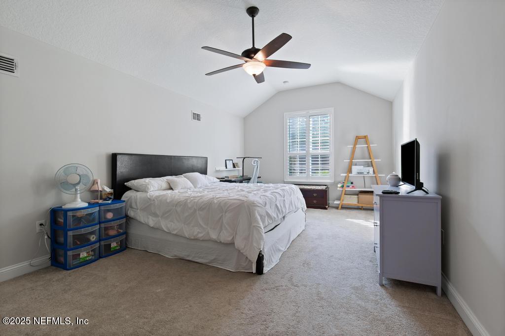 10944 Lothmore Road Jacksonville, FL 32221 - Photo 53 of 85 a bed room with bed and window