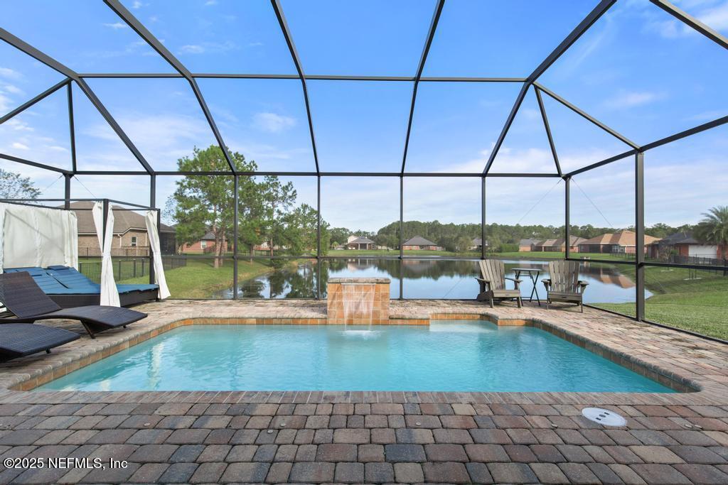 10944 Lothmore Road Jacksonville, FL 32221 - Photo 59 of 85 a view of a swimming pool with a lounge chair