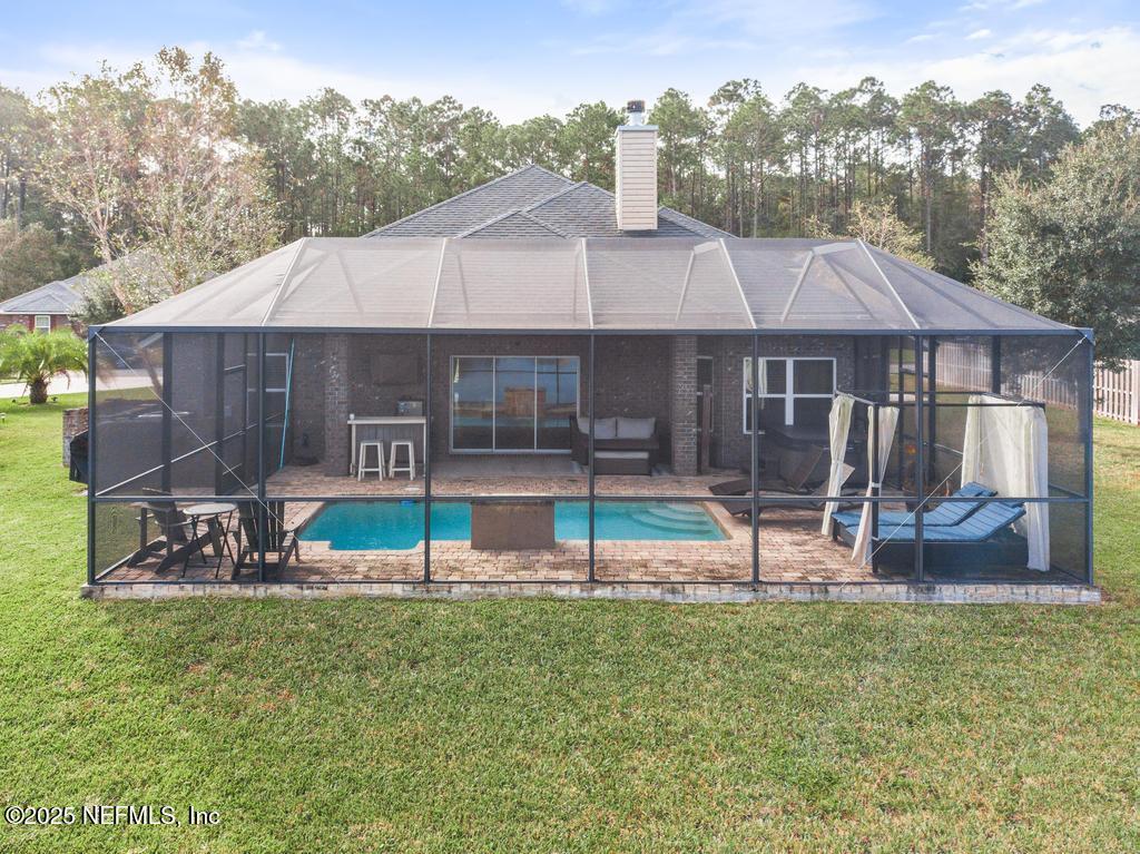 10944 Lothmore Road Jacksonville, FL 32221 - Photo 72 of 85 a view of a house with a yard and sitting area