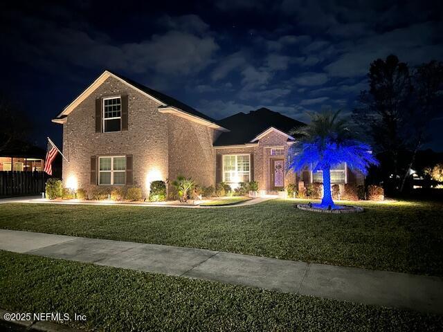 10944 Lothmore Road Jacksonville, FL 32221 - Photo 9 of 85 a front view of a house with a yard fire pit and outdoor seating