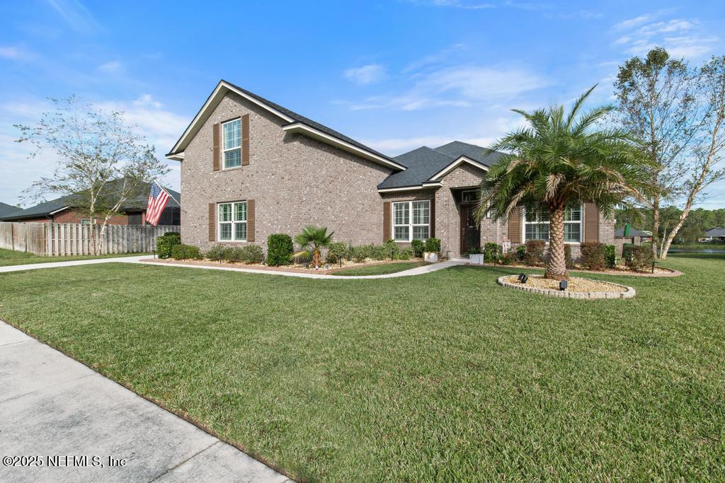 10944 Lothmore Road Jacksonville, FL 32221 - Photo 10 of 85 a front view of house with yard and green space