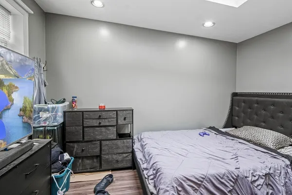 a bedroom with a bed and a desk