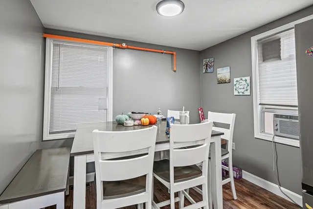 a dining room with a table and chairs