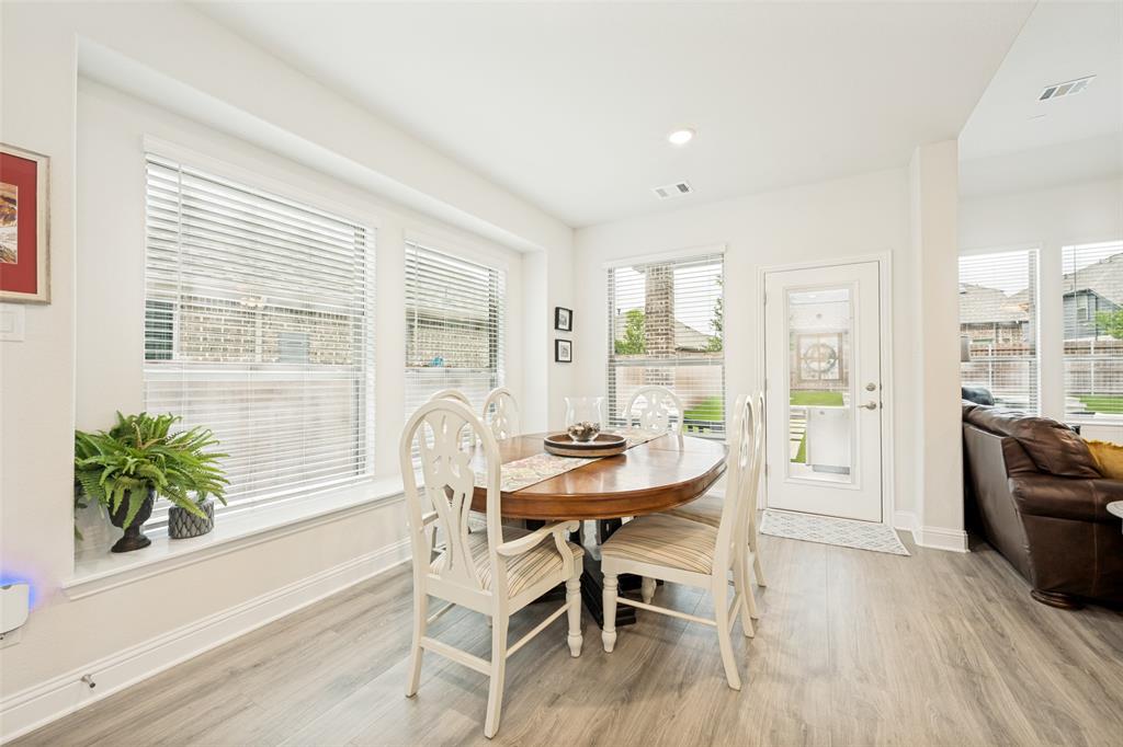 2508 Henley Way Mansfield, TX 76084 - Photo 12 of 25 a dining room with furniture and wooden floor