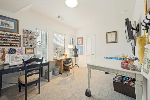 a room with furniture a rug and a window