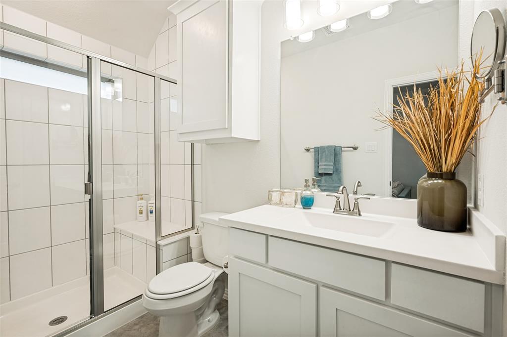 2508 Henley Way Mansfield, TX 76084 - Photo 19 of 25 a bathroom with a sink a toilet and shower