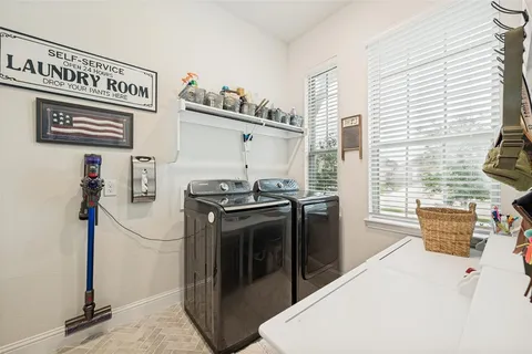 a view of a kitchen with washer and dryer