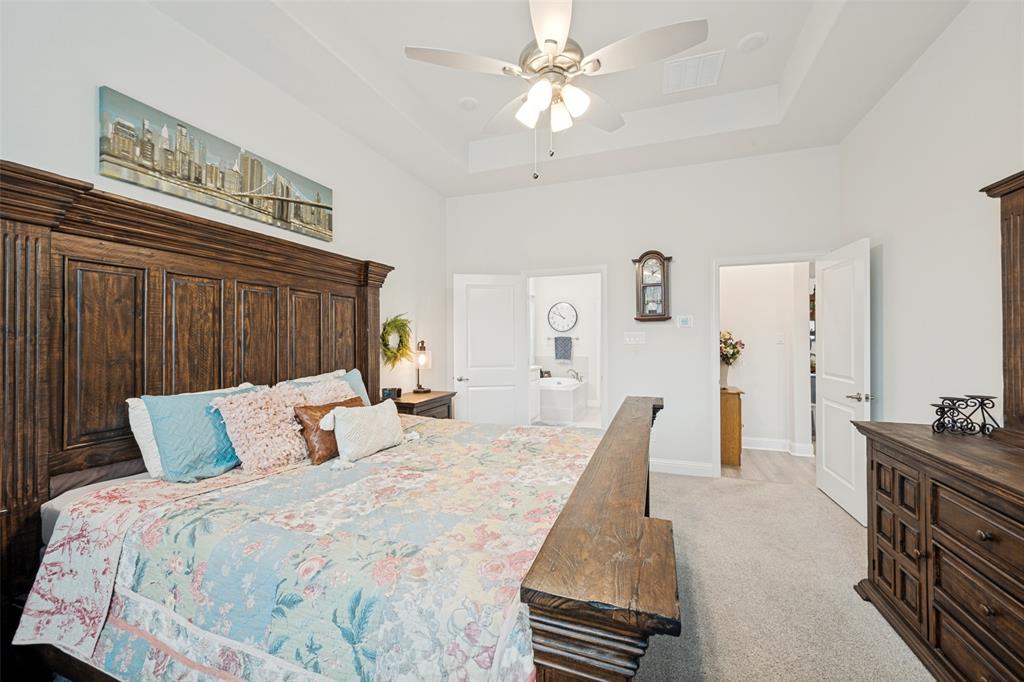 2508 Henley Way Mansfield, TX 76084 - Photo 22 of 25 a bedroom with a bed and a chandelier