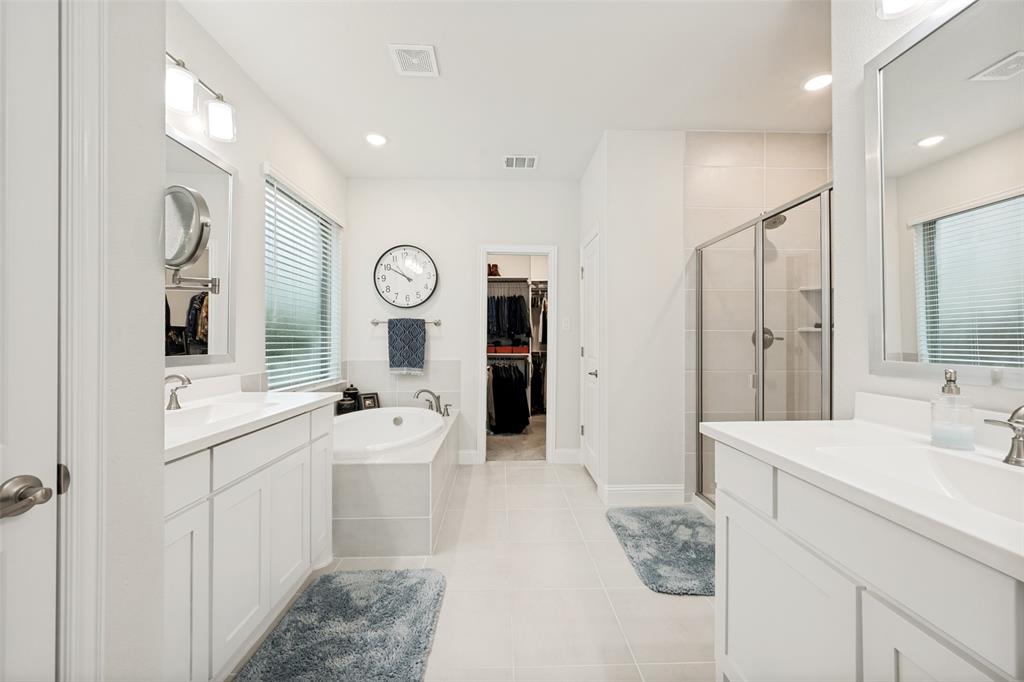 2508 Henley Way Mansfield, TX 76084 - Photo 23 of 25 a spacious bathroom with a double vanity sink mirror and shower