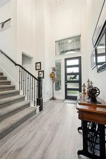 a view of a livingroom with furniture and staircase