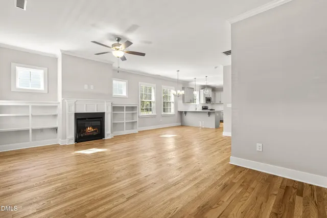 a view of a kitchen with wooden floor and a kitchen