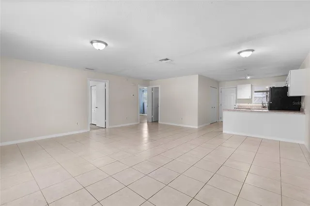 a view of kitchen with a sink stove and cabinets