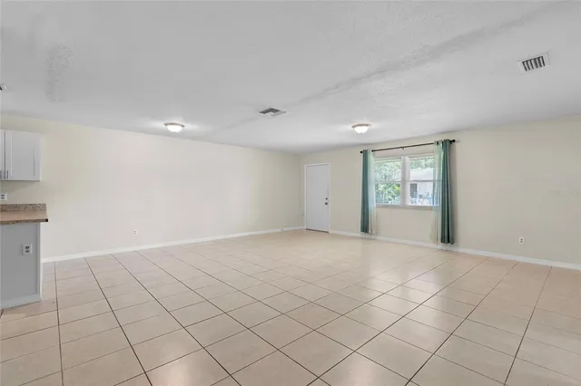 a view of an empty room and window